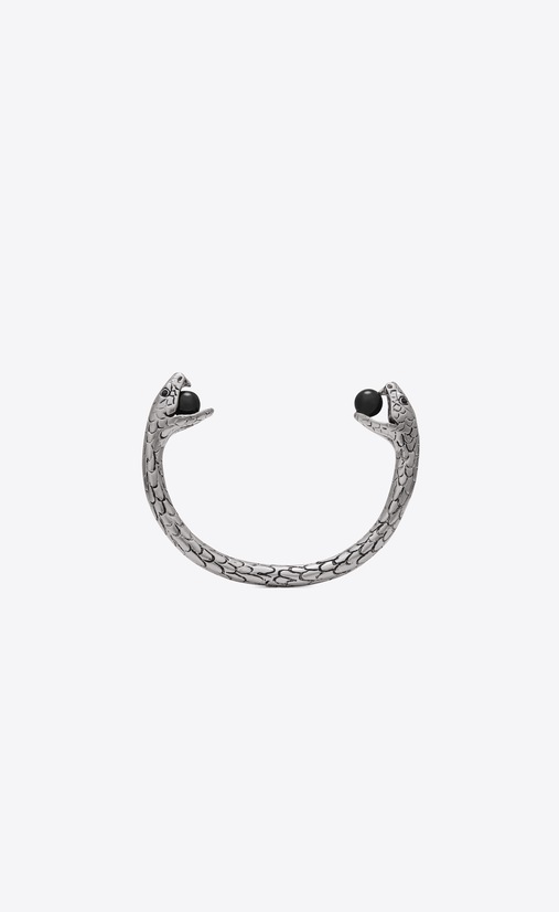 Snake bracelet in silver metal with black glass beads.